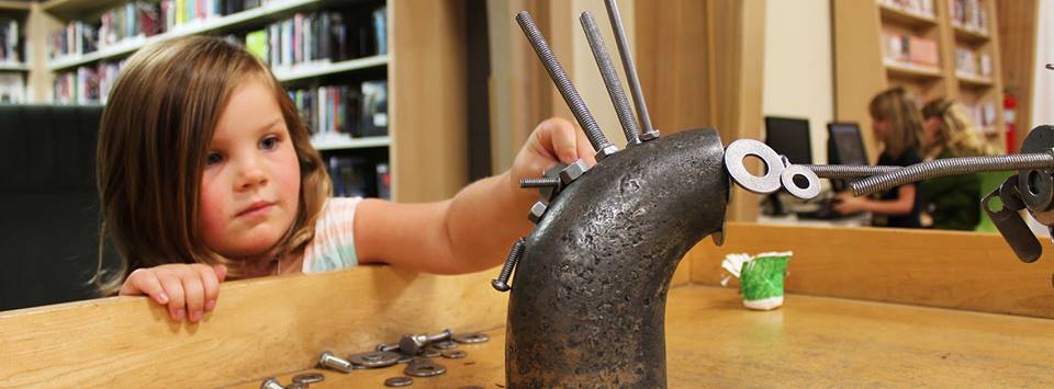 Girl Playing with Magnets